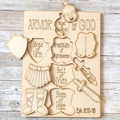 a wooden plaque with the words armor of god and some other things in it on a white wood background