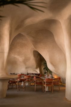 an indoor dining area with tables and chairs