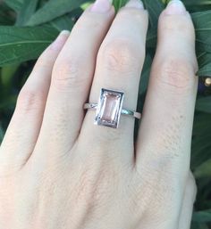 "A stunning north south setting featuring a rectangle shaped genuine flawless Morganite from Brazil is bezel set with a polish finish makes a lovely engagement/promise/statement ring. Wrapped in a box ready for gift-giving. Morganite measure 9.5mm x 6mm ---> Don't know your ring size? Purchase our ring sizing gauge https://www.etsy.com/listing/290720637/ring-sizer-ring-sizing-gauge-multisizer?ga_search_query=ring+sizer&ref=shop_items_search_1 *Follow us @belesasjewelry on Instagram for pr Minimalist Promise Ring, Pink Stone Engagement Rings, Engagement Ring Modern, Modern Engagement Rings, Moonstone Engagement Ring, Morganite Ring, North South, Stone Engagement Rings, Ring Sizer