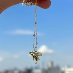 "FLYING PIG NECKLACE Fan of animals? this adorable flying pig necklace is for you. MATERIALS: -18k Gold Filled Charm  -18k Gold Filled Satélite Chain -18k Gold Filled Lobster Closure  -Lead & Nickel FREE SIZE: -16\" inch + 1 inch extensor Chain Style: -18k Gold Filled Satelite Chain  PACKAGING: -Black Velvet Bag -Jewelry Care Card -Personalized Gift Note (Optional)  JEWELRY CARE  -Allow perfumes and lotion dry before wearing -Remove before showering -Remove when working out -Store in a close bag or box FREE SHIPPING NOTE: THE PRICE SHOWN IS FOR ONE ITEM, Layering pieces shown maybe purchased separately." Pig Necklace, Jewelry Valentines Day, Pig Jewelry, Snake Ears, Animal Necklace, Bag Jewelry, Flying Pig, Pet Necklace, Care Card