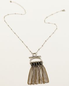 Silver-tone long chain with stationed beads. Lobster clasp closure. Mixed gold- and silver-tone fringe chain pendant design. Imported. Metal Lariat Jewelry With Chain Detail, Metal Lariat Chain Jewelry, Metal Tassel Necklace With Adjustable Chain For Parties, Metal Layered Necklace With Beaded Chain For Party, Elegant Beaded Chain Metal Necklace, Adjustable Metal Layered Necklace With Beaded Chain, Metal Necklaces With Delicate Chain, Metal Lariat Necklace With Chain For Party, Silver Metal Beaded Necklace With Adjustable Chain