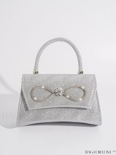 BagForLove - Chic Mini Evening Bag with Bowknot and Rhinestone Embellishments Product Description Color Silver Details Rhinestone Magnetic Yes Strap Type Chain Bag Size Mini Style Glamorous Pattern Type Plain Closure Type Magnet Type Square Bag Material Glitter Composition 100% Polyester Care Instructions Do not wash Size Chart INCH CM Bag Height Bag Length Bag Width Handle Height Strap Length 4.7 inch 7.9 inch 2.6 inch 3.1 inch 47.2 inch Bag Height Bag Length Bag Width Handle Height Strap Length 12 cm 20 cm 6.5 cm 8 cm 120 cm Details Pictures Similar Products h2 { text-align: center; } /* æ¢è¡ */ li{ white-space: normal; word-break: break-all; word-wrap: break-word; } .red-box { width: 100%; display: flex; flex-direction: row; flex-wrap: wrap; justify-content: center; } .red-box > div { Wedding Bags With Silver-tone Hardware, Elegant Bags With Silver-tone Hardware As A Gift, Silver Embellished Top Handle Evening Bag, Silver Event Bag With Pearl Handle, Fancy Bags, Rhinestone Embellishments, Pink Backpack, Word Wrap, Chain Bag