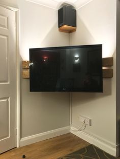 a flat screen tv mounted to the side of a wall