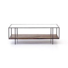 a glass and metal coffee table with wooden shelf on the bottom, against a white background