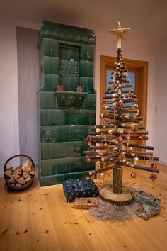 a small christmas tree sitting on top of a wooden table