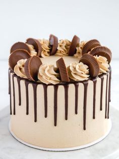 a white cake with chocolate and peanut butter frosting