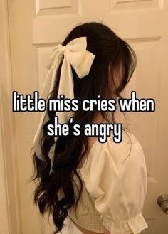 a girl with long hair wearing a bow in her hair and the words little miss cries when she's angry