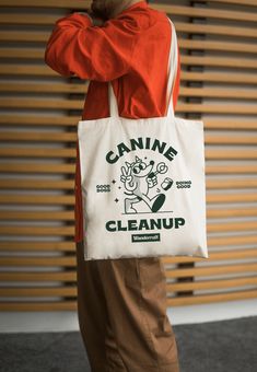 Canine Cleanup Club members assemble! Say no to plastic bags and yes to our organic, recycled cotton tote bag. Eco-conscious dog parents can look good while doing good with this reusable shopper. Global Organic Textile Standard (GOTS) certified organic cotton 60% recycled cotton Printed using environmentally-friendly water-based dyes 15.75" x 15.75" 1% of sale goes to eco-causes Shipped in eco-friendly packaging Say No To Plastic Bags, Say No To Plastic, Dog Tote Bag, Product Shoot, Dog Parents, Just Peachy, Metal Accessories, Fragrance Gift Set, Wholesale Shoes