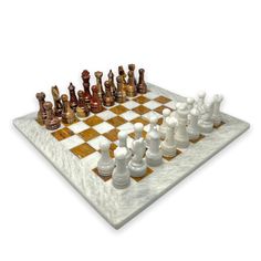 a chess board with white and brown pieces