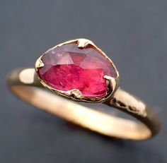 I created this setting in wax then cast it in recycled solid 18k Yellow gold at my home studio. This ring is a size 7 it can be resized up or down. The stone is a tourmaline. it measures about 6mm X 8mm I created a rustic texture in the gold. The band is around 2mm. Throughout all time and history, in every tribe and culture all around the world crystals, minerals and gemstones have used for healing, luck, divination, adornment vibrational medicine and so much more. Red Tourmaline Fine Jewelry Rings, Fine Jewelry Red Tourmaline Rings, Red Tourmaline Rings Fine Jewelry, Red Tourmaline Gemstone Ring, Vibrational Medicine, Rustic Texture, Red Gemstones, 18k Gold Ring, Minerals And Gemstones