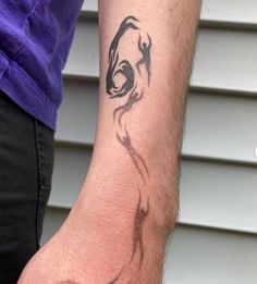 a man with a tattoo on his arm