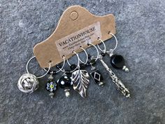 "Set of 7 Premium Glass, Stone & Crystal Black and Silver Hair rings  1\" hoops  1 1/8\"- 1 1/2\"\" tall charms NOTE: ** Some minor beads may Vary.  Focal Beads will always be as shown See All Hair rings here: https://www.etsy.com/shop/vacationhouse?search_query=Z737 See all our hair accessories here... https://www.etsy.com/shop/vacationhouse?section_id=10686460 VACATIONHOUSE Fine Quality Hats, Beanies, Leather Jewelry,  Leather Hair Wraps & Accessories. Luxury Fibers & Italian Leathers www.Vaca Black And Silver Hair, Silver Braided Ring, Hair Charms, Braid Jewelry, Dreadlock Beads, Hair Chains, Braided Ring, Focal Beads, Hair Wraps