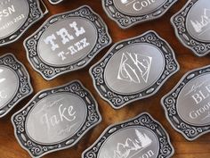 six metal coasters with the words take back written in white ink on them, sitting on a wooden surface