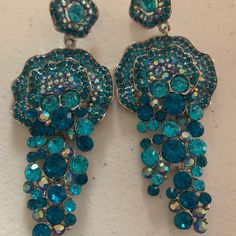 Swarovski Crystals Pierced 3 Colors Of Turquoise Turquoise Chandelier Earrings For Party, Turquoise Dangle Earrings For Party, Blue Rhinestone Dangle Earrings, Blue Dangle Earrings With Rhinestones, Turquoise Dangle Chandelier Earrings For Party, Blue Crystal Rhinestone Earrings, Blue Dangle Clip-on Earrings For Party, Turquoise Drop Crystal Earrings For Party, Pageant Earrings