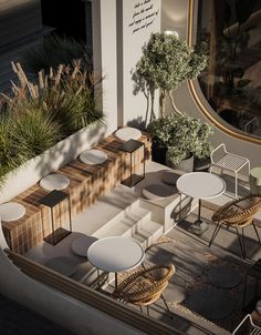 an outdoor seating area with tables and chairs