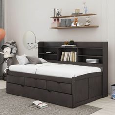 a child's bedroom with a bookcase bed and toy storage boxes on the floor