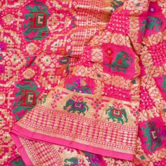 pink and green sari with elephants on the border, sitting on top of each other