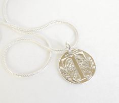 Absolutely gorgeous, detailed, double sided Monogram Pendant made with Silver Precious Metal Clay (PMC). Great for weddings as Bridesmaid gifts, Mother's Day gift, graduations and any occasion where you'd like to give (or wear) something unique and personal! I stamped the PMC with a wax seal. On the back side the pendant is textured too. After firing I hand-polish the pendant to a high shine. The pendant is about 3/4in in diameter (2cm). A Sterling Silver Box chain is an option at checkout for $ Thick Silver Necklace, Wax Seal Pendant, Solid Necklace, Thick Gold Chain, Gold Snake Chain, Monogram Pendant, Silver Chain For Men, Precious Metal Clay, Fine Silver Jewelry