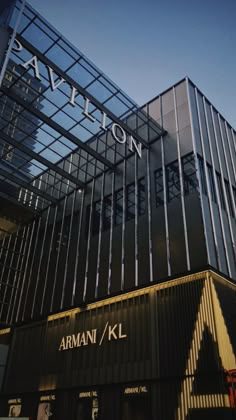 an armani kl building with the name pavilion on it's glass roof