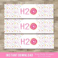 two pink donuts with sprinkles on them and the words h2h2