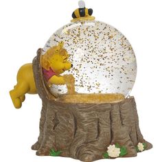 a snow globe with winnie the pooh in it