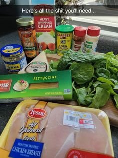 some meat and vegetables are on a counter next to an open package of chicken breast seasoning