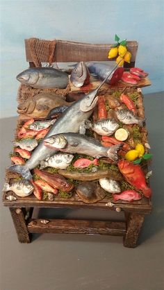 a wooden table topped with lots of fish