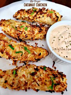 chicken skewers on a plate with dipping sauce