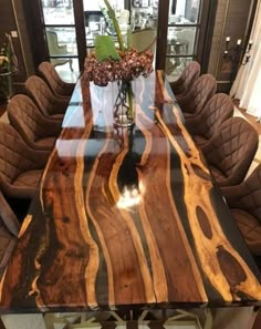 a large wooden table with chairs around it