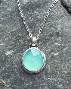 A beautiful, large, faceted turquoise/aqua chalcedony cabachon stone, set in a purpose made recycled sterling silver bezel, largely made out of my own silver offcuts, and with a gorgeous, detailed, floral embossed bail.  She's a real beauty!  This pendant measures 3cm high by 2cm wide You can see in the photos and drop down options, that there is a choice of chain type, as well as chain length. The hammered trace has the elongated flat links, whilst the belcher chain is thicker, smaller, and mor Turquoise Chalcedony Gemstone Necklace, Turquoise Chalcedony Jewelry With Natural Stones, Silver Faceted Chalcedony Jewelry, Faceted Silver Chalcedony Jewelry, Turquoise Chalcedony Necklace For Gift, Silver Chalcedony Jewelry, Faceted, Sterling Silver Turquoise Faceted Necklace, Colour Analysis, Chalcedony Necklace