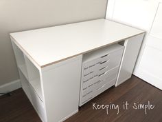 a white desk with several drawers on it