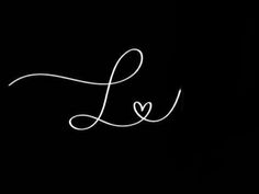 the word love written in white ink on a black background