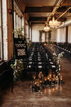 rows of chairs with signs and candles on them