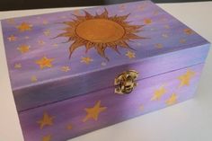 a purple box with gold stars painted on it