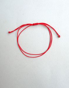 Red string bracelet, Simple Nylon Cord Wish Bracelet, Protection Jewelry, Kabbalah Bracelet, Lucky bracelet, Good luck bracelet, Family gift This bracelet is made of two red chinese nylon cords and has gold plated beads at ends. It is adjustable to fit all sizes. *Colours may differ slightly from the original due to the configuration of your computer. *There may be light variations on colour and size. *Items appear larger on your monitor than actual size. Red Adjustable Friendship Jewelry, Red Adjustable Cord Jewelry For Friendship, Red Adjustable Cord Friendship Jewelry, Red Minimalist Bracelets With Adjustable Cord, Minimalist Red Bracelet With Adjustable Cord, Minimalist Red Bracelets With Adjustable Cord, Red Adjustable Friendship Bracelets, Casual Nylon Thread Bracelets As Gift, Adjustable Red Friendship Bracelets For Good Luck