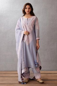 Sea blue kurta with dori embroidery and front buttons. Paired with embroidered salwar and embroidered dupatta.
Component: 3
Pattern: Embroidered
Type Of Work: Dori Work
Neckline: Round
Sleeve Type: Long Sleeves
Fabric: Kurta: Handwoven Chanderi, Cotton Voile; Salwar: Handwoven Chanderi; Dupatta: Silk Organza
Color: Blue
Other Details: 
Tassel dupatta
Dori work
Occasion: Destination Wedding, Wedding - Aza Fashions Dori Work, Embroidered Salwar, Blue Kurta, Dress Design Patterns, Silk Organza, Indian Designer, Indian Designer Wear, Kurta Set, Designer Gowns