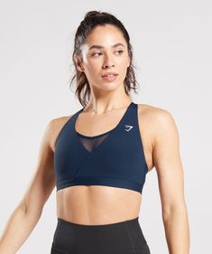 IT’S NOT YOU; IT’S YOUR SPORTS BRA Your training requires the right amount of support. With lightweight, breathable designs, comfortable cups and supportive straps, you can rely on our sports bras to be there for you, and for yours. Layer your look under a top or wear alone with your favourite leggings or shorts. No matter what, you’re free to focus on nothing but your performance. - Light support- Low coverage- Crossover detail- Mesh racerback for breathability- Cut out to back- Unpadded but wi Criss Cross Bra, Gray Sports Bra, Strappy Bra, Gymshark Women, Black Seamless, Seamless Sports Bra, Pink Sports Bra, Seamless Bra, Sports Bra Sizing