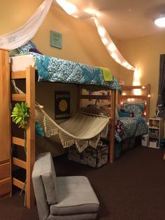 a bedroom with bunk beds and hammocks in it