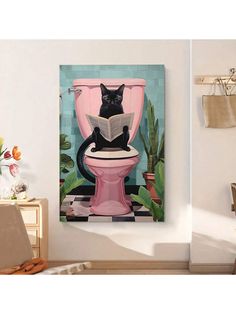 a black cat sitting on top of a pink toilet reading a book in a bathroom