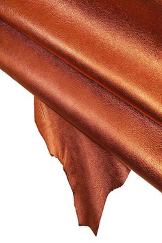 a close up view of the top of a table with a brown cloth on it