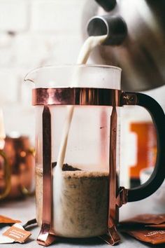 a blender filled with liquid being poured into it