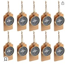 a set of eight wooden tags with compasss on them