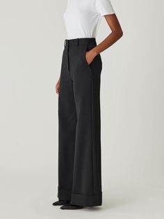 Featuring a high waist, sophisticated wide-leg silhouette, and chic cuff details, these trousers offer a polished and elegant look. High waist Wide-leg silhouette Chic cuff details 41% Wool, 52% Polyester, 4% Elastane, 3% Polyamide Dry Clean Only Formal Structured Bottoms With Pressed Crease, Chic Wide Leg Pants With Pressed Crease For Evening, Elegant Structured Pants For Formal Occasions, Elegant Structured Formal Pants, Modern Full Length Wide Leg Pants For Evening, Classic High Waist Pantsuit For Formal Occasions, Modern Structured Bottoms For Formal Occasions, Modern Structured Formal Bottoms, Elegant Solid Color Wide Leg Pants For Formal Occasions