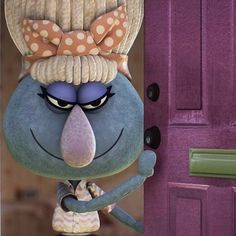 a cartoon character standing in front of a purple door with polka dots on it's head