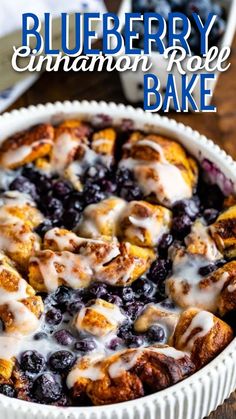 a blueberry cobbler in a white dish with icing drizzled on top