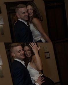 two people are hugging each other in front of a door and the woman is wearing a white dress