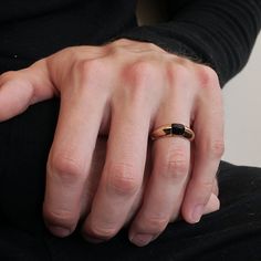 Read about our payment plans before proceeding.A beautiful sleek beveled ring band tapering from 7~3mm holds a natural custom cut onyx. Custom cut in a pyramid cabochon shape. A simple and classic design for a stylish man who wants a ring that's unique but doesn't stand out too much. Handcrafted in sterling silver and 14K solid gold. Materials:- Sterling silver and 14k solid gold- Natural cabochon pyramid cut onyx- 7~3mm tapered beveled bandwidth ** Tippy Taste Men's are made-to-order. Please al Minimalist Onyx Rings For Formal Occasions, Minimalist Onyx Ring For Formal Occasions, Minimalist Onyx Signet Ring For Formal Events, Minimalist Onyx Signet Ring For Formal Occasions, Minimalist Black Couple Rings For Anniversary, Bevel Ring, Man Ring, Stylish Man, Ring Band