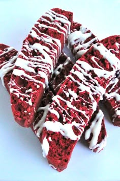 red velvet cake slices with white icing on top