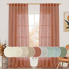 the curtains are open and ready to be hung in front of an open window with four different colors