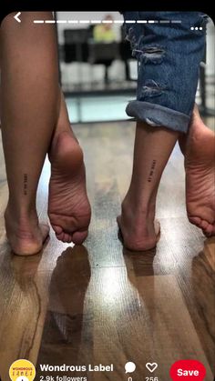 two people standing on top of a wooden floor with their bare feet in the air